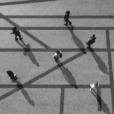 Shadows rotate around six stationary people as the light shifts